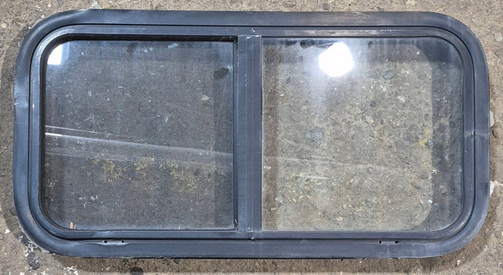 Used Black Radius Opening Window : 29 1/2" W x 14 3/4" H x 1 7/8" - Young Farts RV Parts