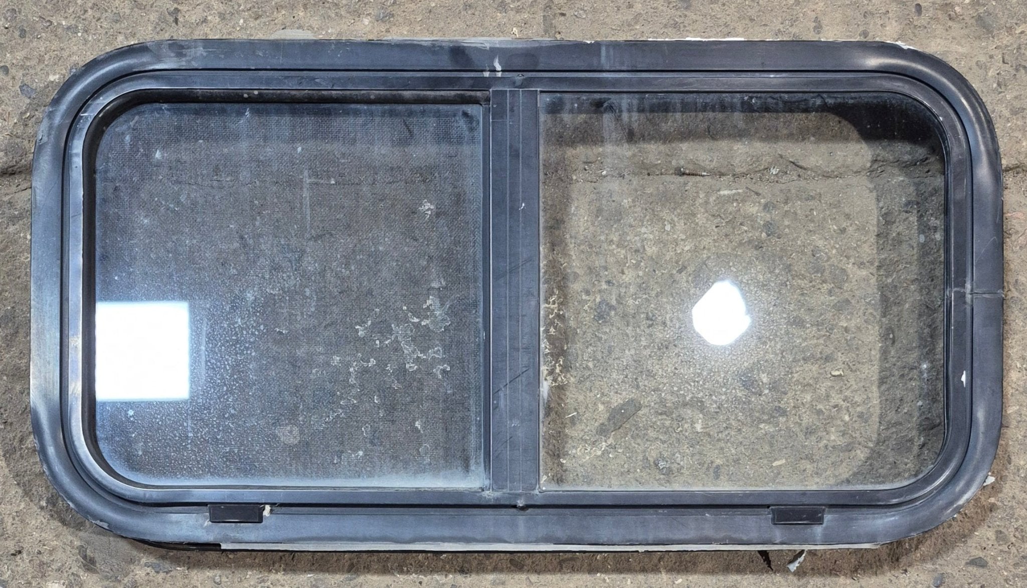 Used Black Radius Opening Window : 29 1/2" W x 14 3/4" H x 1 7/8" - Young Farts RV Parts