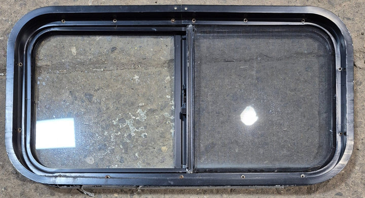 Used Black Radius Opening Window : 29 1/2" W x 14 3/4" H x 1 7/8" - Young Farts RV Parts