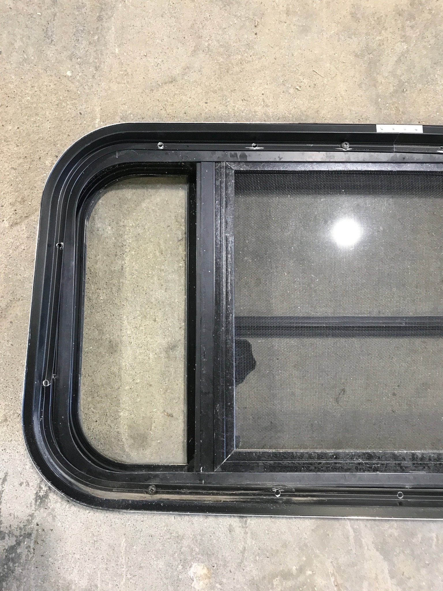 Used Black Radius Opening Window : 29 1/2" W x 14 3/4" H x 2" - Young Farts RV Parts