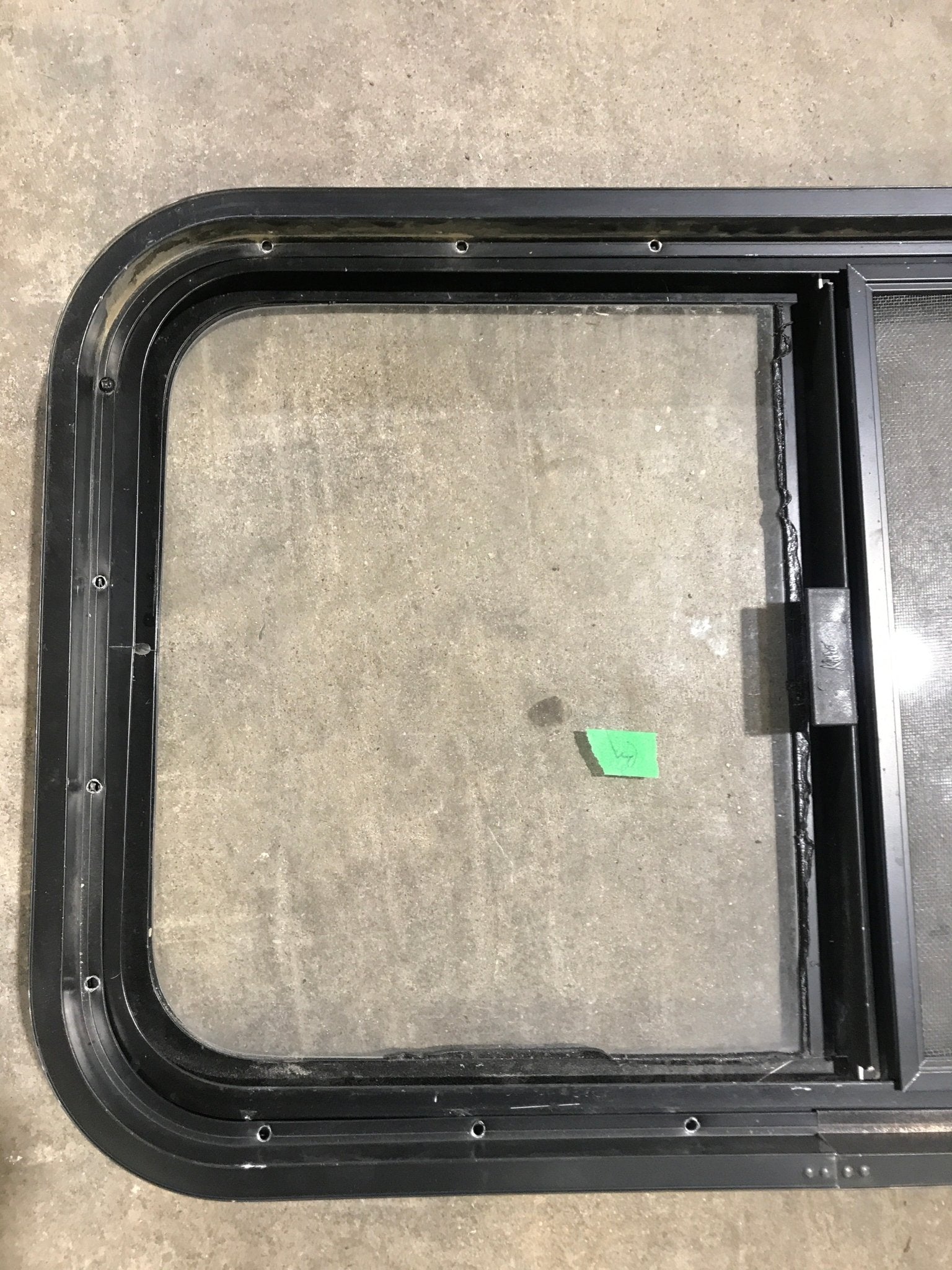 Used Black Radius Opening Window : 29 1/2" W x 17 1/2" H x 2" D - Young Farts RV Parts