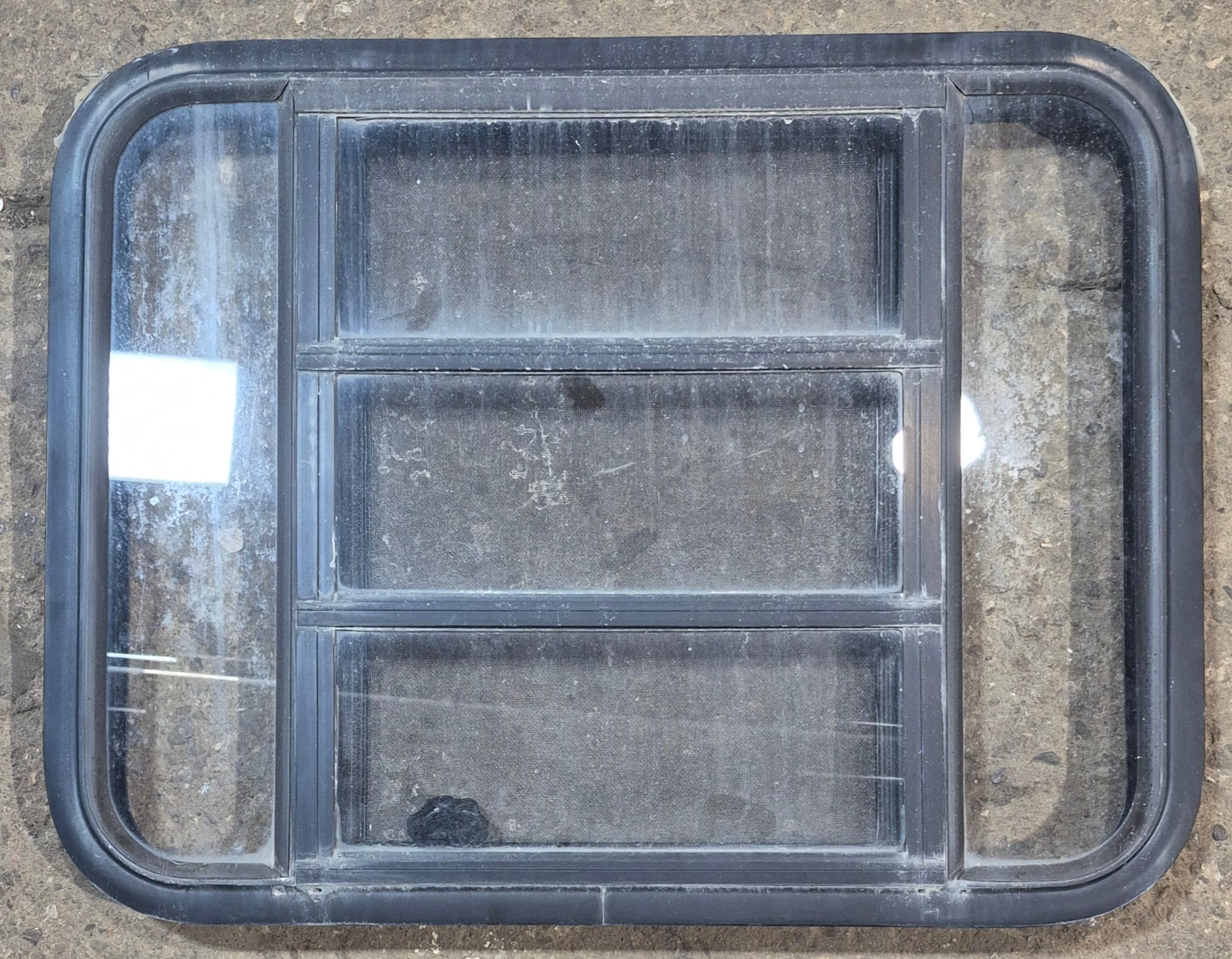 Used Black Radius Opening Window : 29 1/2" W x 22 1/2" H x 1 3/4" - Young Farts RV Parts