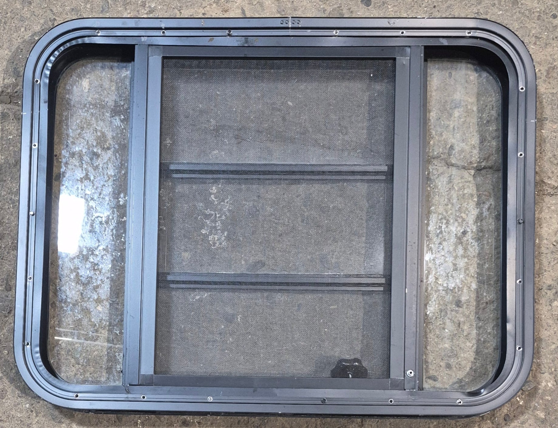 Used Black Radius Opening Window : 29 1/2" W x 22 1/2" H x 1 3/4" - Young Farts RV Parts