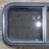 Used Black Radius Opening Window : 29 1/4" W x 14 1/4" H x 1 3/4" - Young Farts RV Parts
