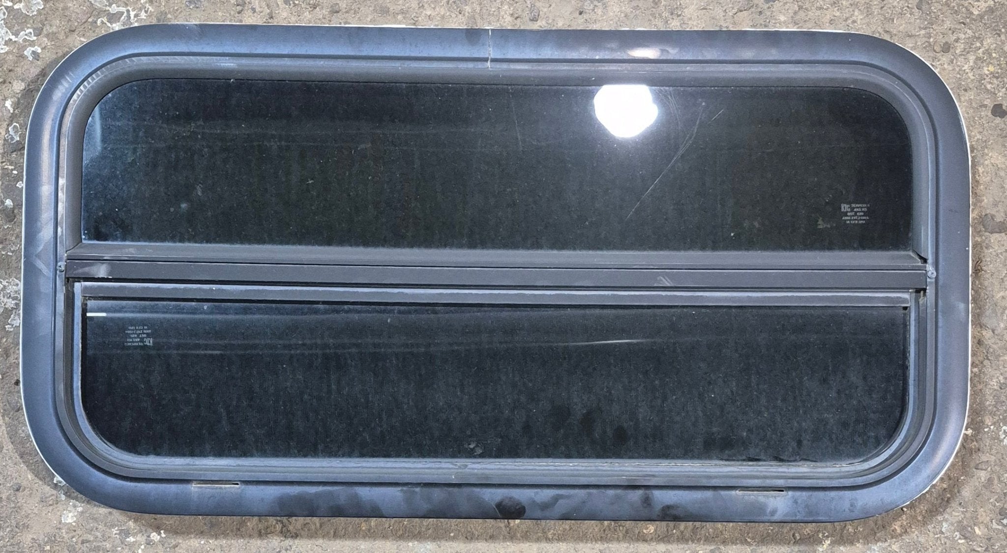 Used Black Radius Opening Window : 29 1/4" W x 14 1/4" H x 1 3/4" - Young Farts RV Parts