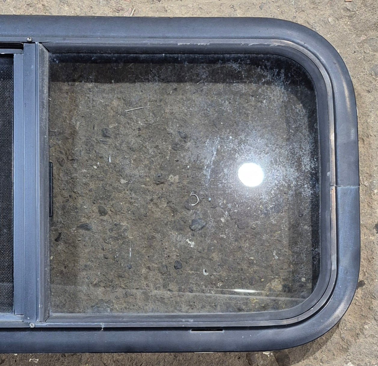 Used Black Radius Opening Window : 29 1/4" W x 14 1/4" H x 1 3/4" - Young Farts RV Parts