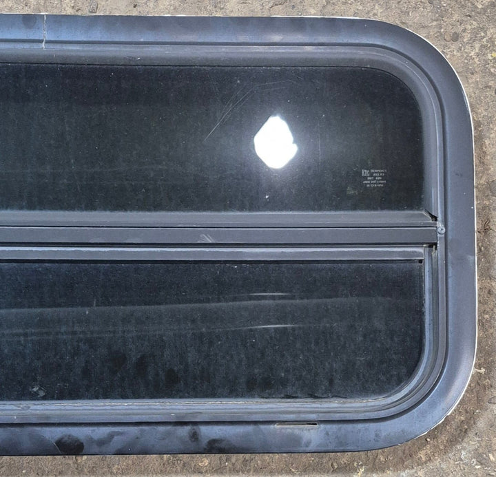 Used Black Radius Opening Window : 29 1/4" W x 14 1/4" H x 1 3/4" - Young Farts RV Parts