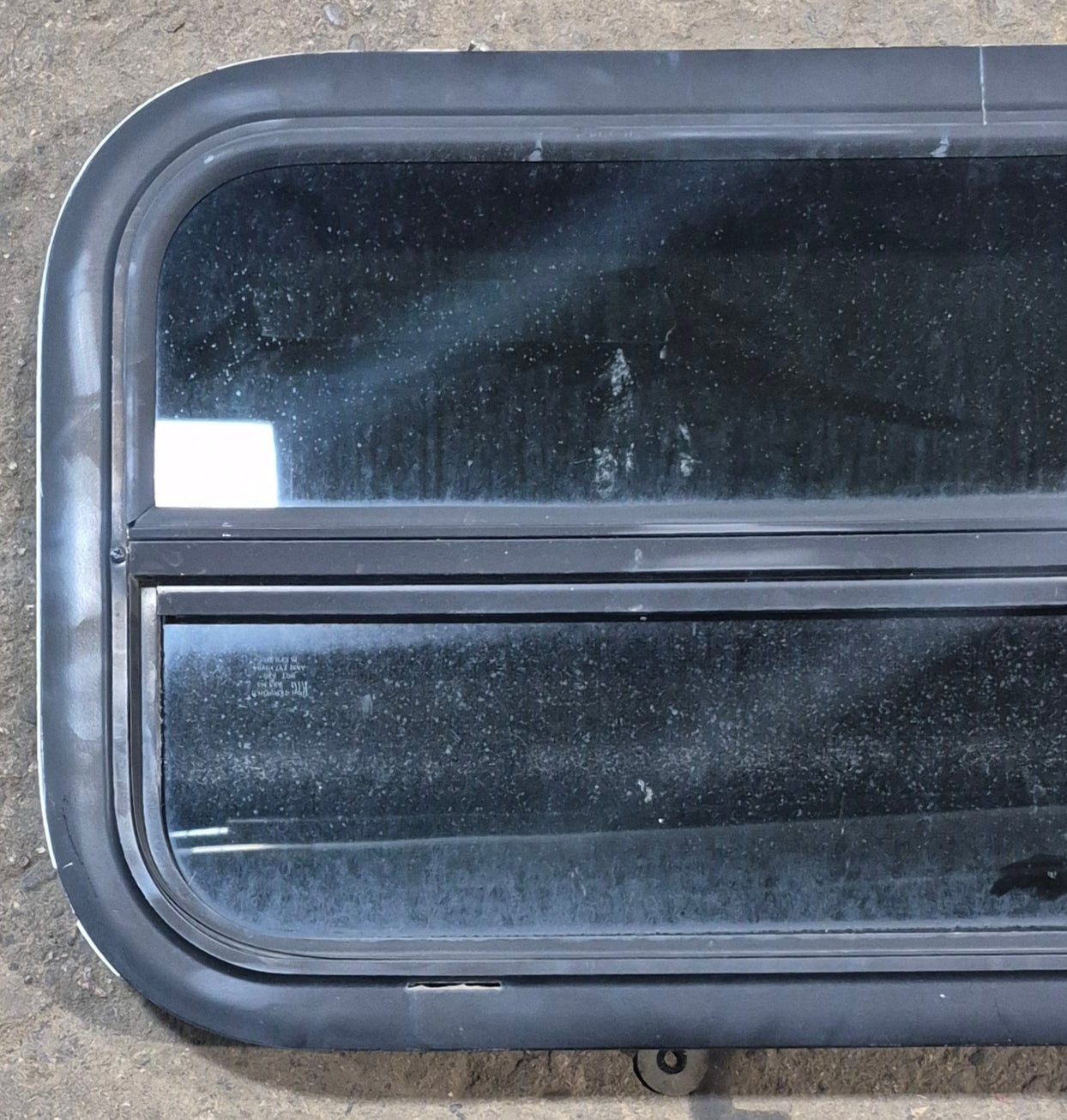 Used Black Radius Opening Window : 29 1/4" W x 14 1/4" H x 1 3/4" - Young Farts RV Parts