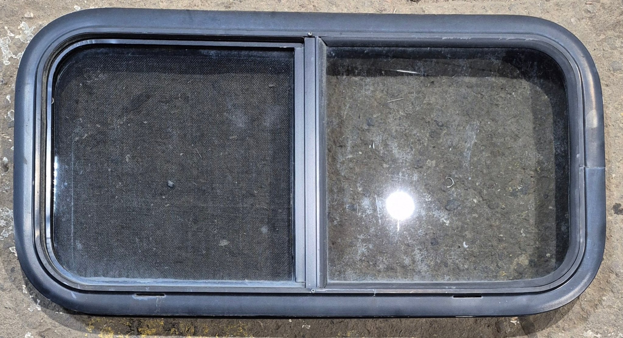 Used Black Radius Opening Window : 29 1/4" W x 14 1/4" H x 1 3/4" - Young Farts RV Parts