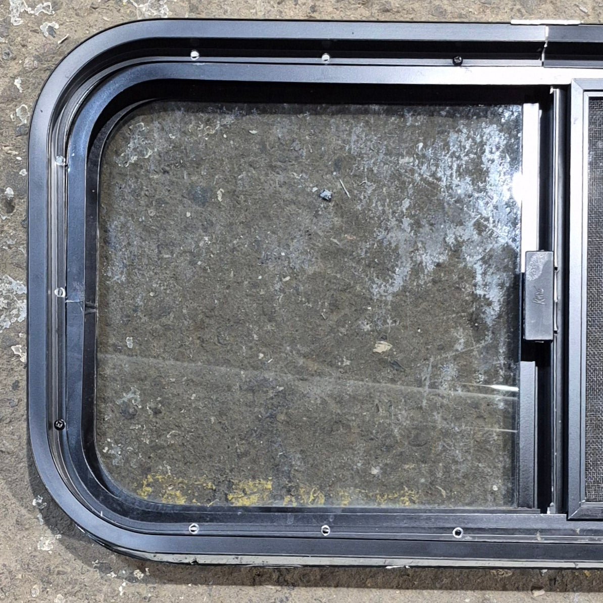 Used Black Radius Opening Window : 29 1/4" W x 14 1/4" H x 1 3/4" - Young Farts RV Parts