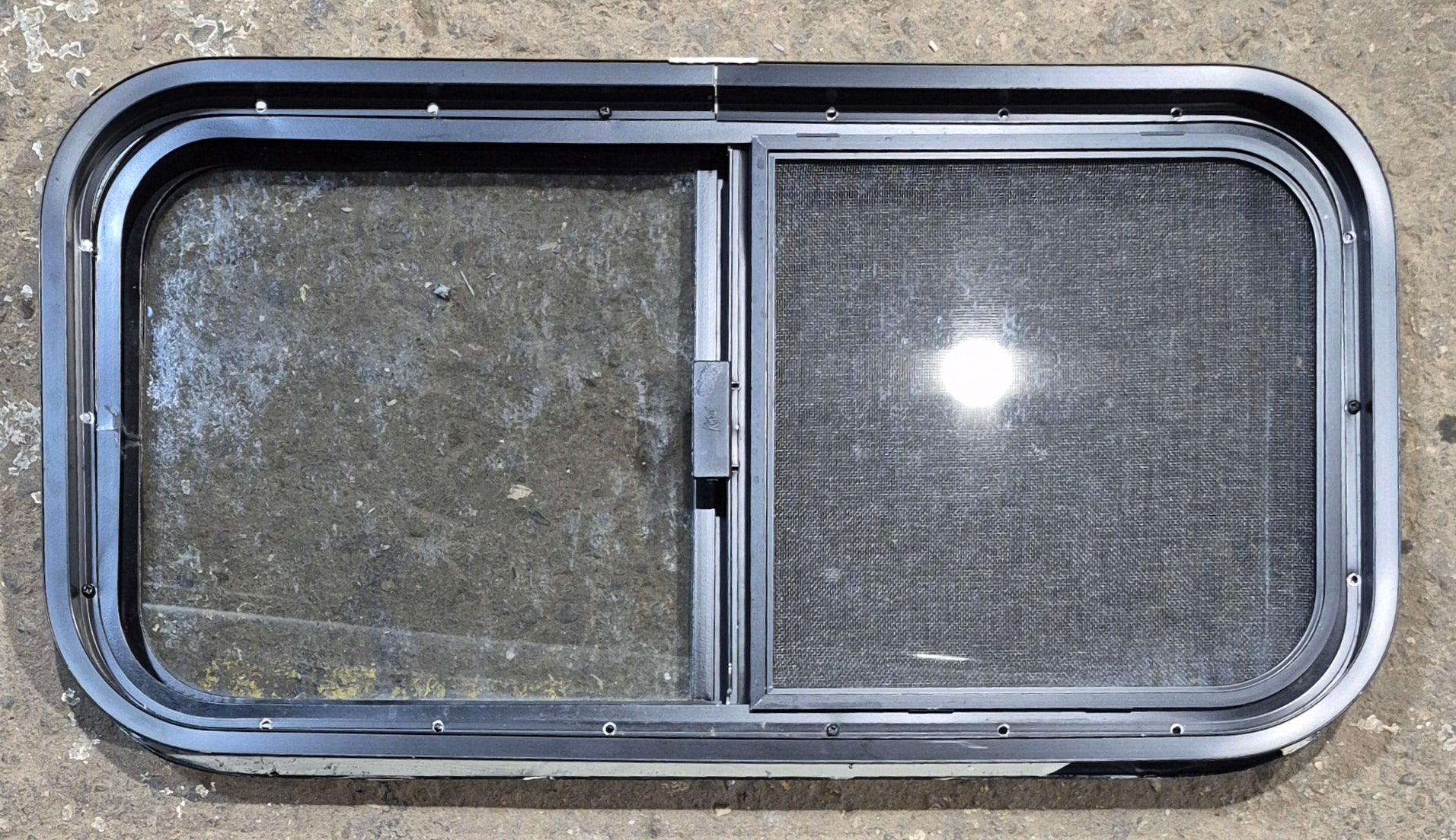 Used Black Radius Opening Window : 29 1/4" W x 14 1/4" H x 1 3/4" - Young Farts RV Parts
