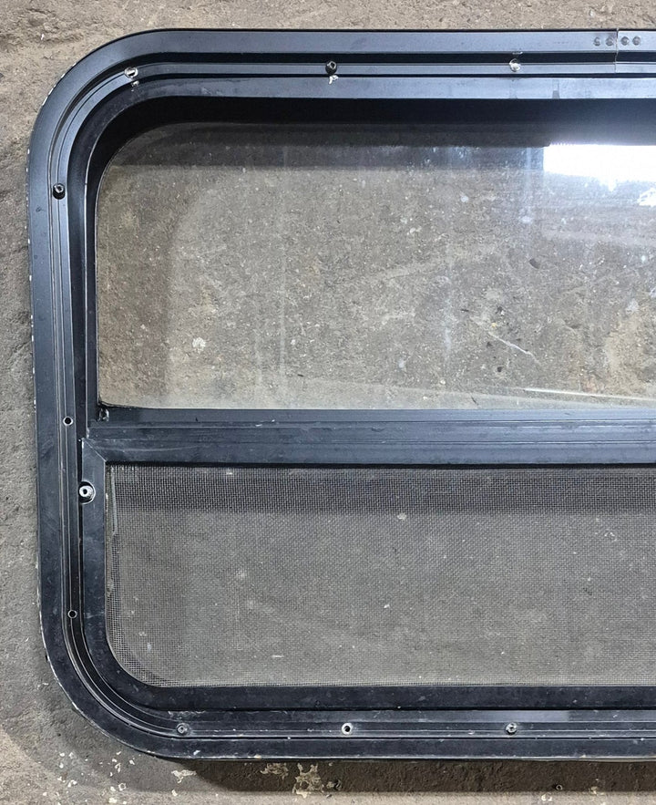 Used Black Radius Opening Window : 29 1/4" W x 17 1/2" H x 1 7/8" D - Young Farts RV Parts
