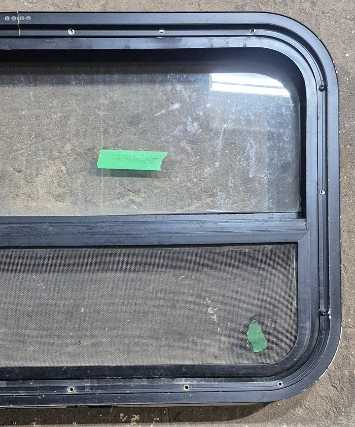 Used Black Radius Opening Window : 29 1/4" W x 17 1/2" H x 1 7/8" D - Young Farts RV Parts