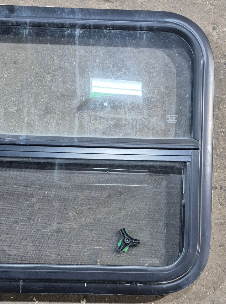 Used Black Radius Opening Window : 29 1/4" W x 21 1/4" H x 1 1/4" D - Young Farts RV Parts