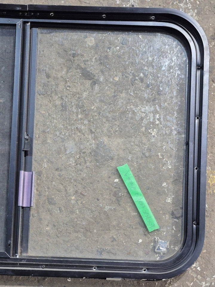 Used Black Radius Opening Window : 29 1/4" W x 21 1/4" H x 1 3/4" D - Young Farts RV Parts