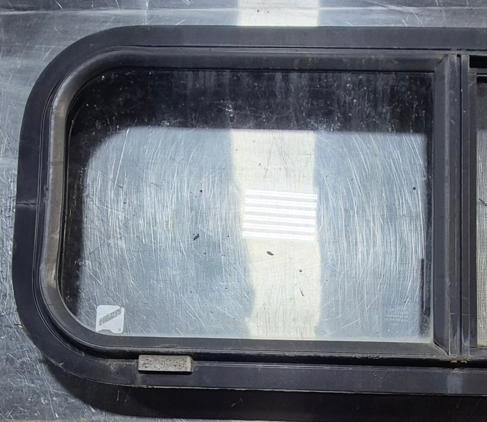 Used Black Radius Opening Window : 30 1/4" W x 11 3/4" H x 1 3/4" - Young Farts RV Parts