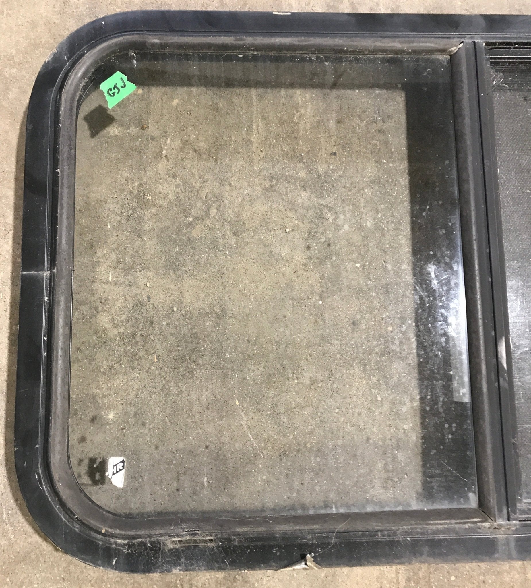 Used Black Radius Opening Window : 30 1/4" W x 17 3/4" H x 1 7/8" D - Young Farts RV Parts