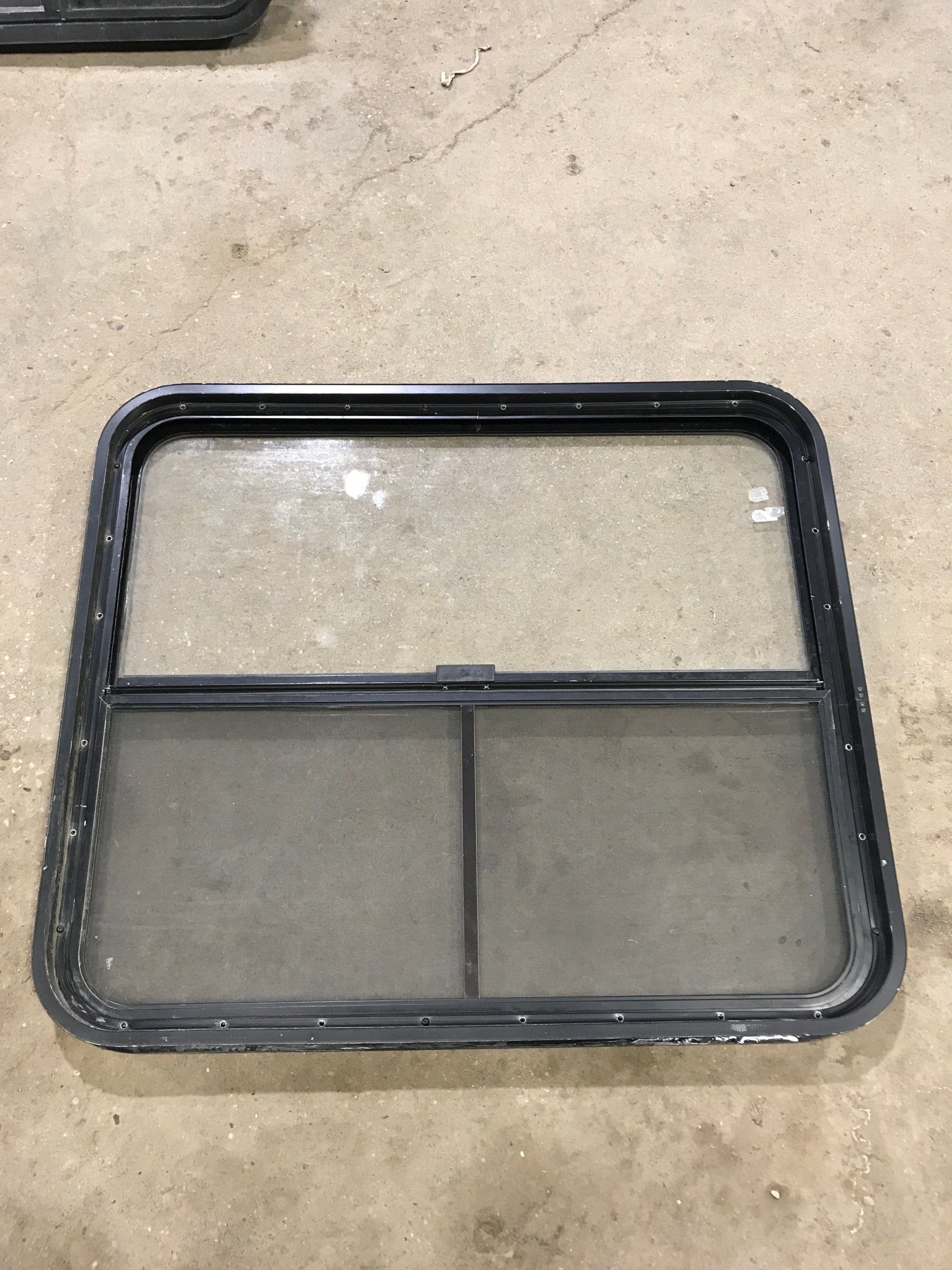 Used Black Radius Opening Window : 34 1/2" W x 29 1/2" H x 1 7/8" D - Young Farts RV Parts