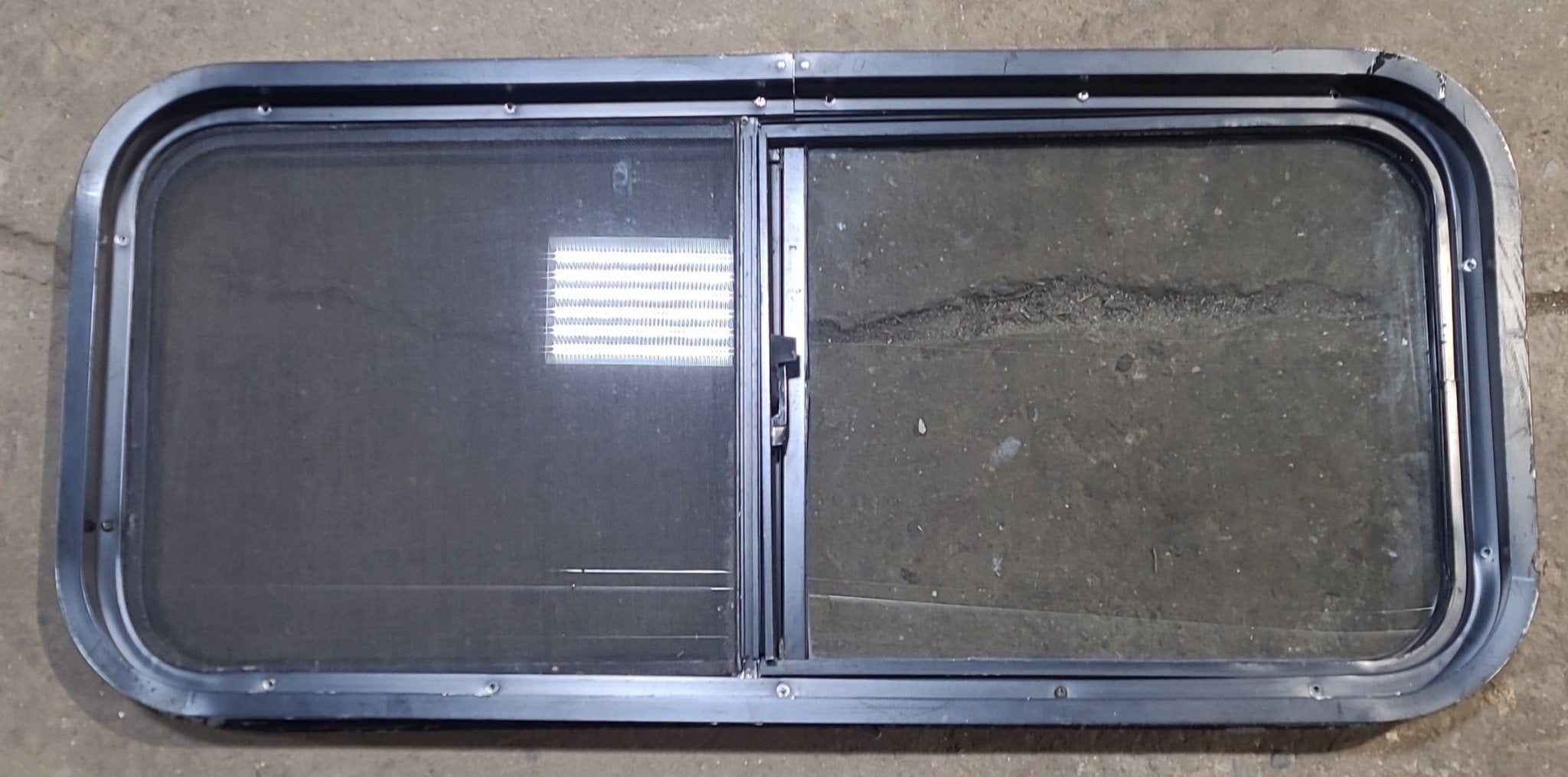 Used Black Radius Opening Window : 35 1/2" W x 15 3/4" H x 2" D - Young Farts RV Parts