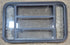 Used Black Radius Opening Window : 35 1/2" W x 21 3/4" H x 1 7/8" - Young Farts RV Parts