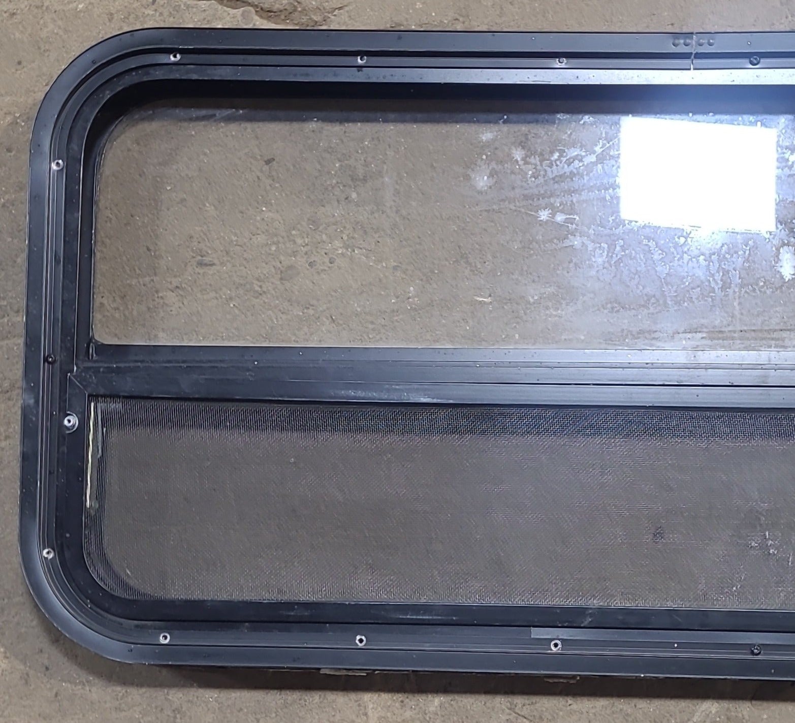 Used Black Radius Opening Window : 35 1/4" W x 17 1/4" H x 1 7/8" D - Young Farts RV Parts