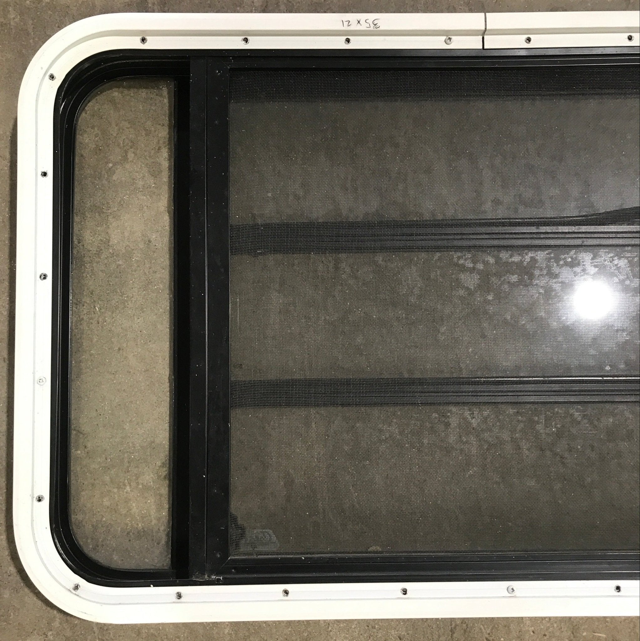 Used Black Radius Opening Window : 35 1/4" W x 21 1/4" H x 1 7/8" D - Young Farts RV Parts