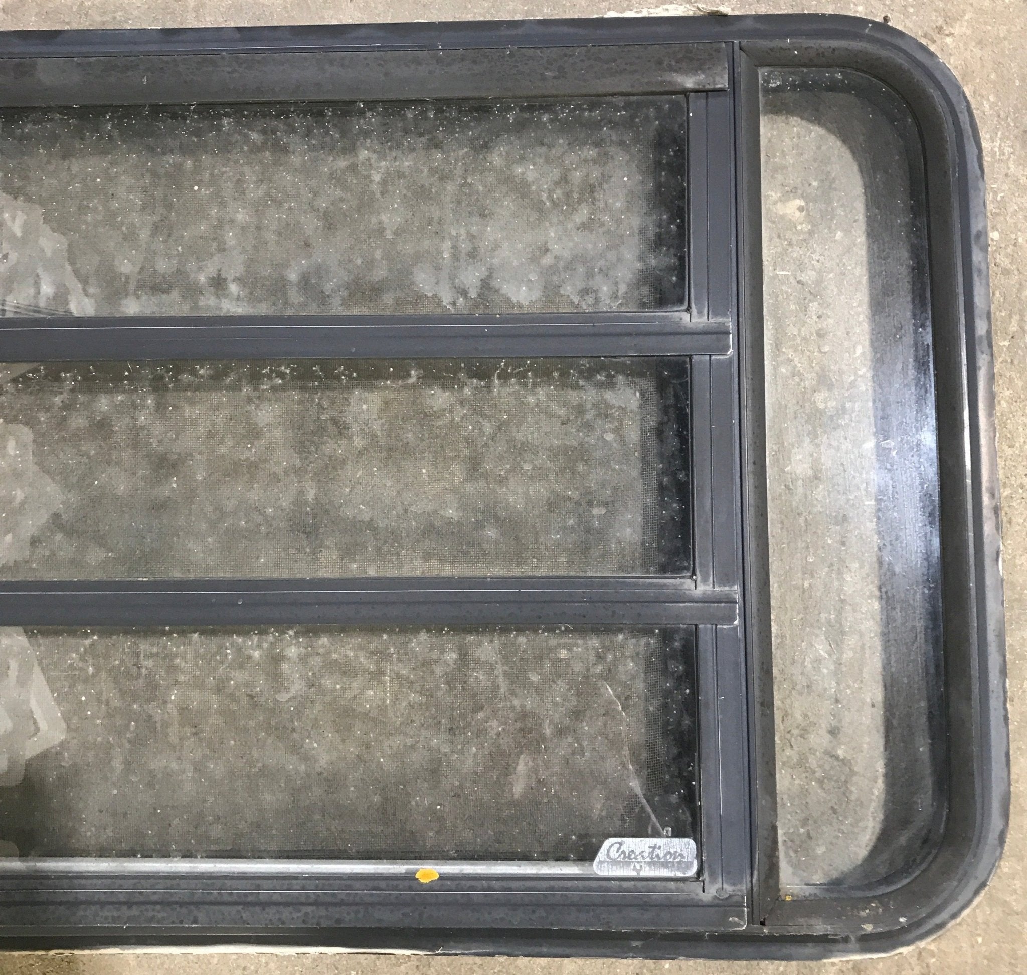 Used Black Radius Opening Window : 35 1/4" W x 21 1/4" H x 1 7/8" D - Young Farts RV Parts