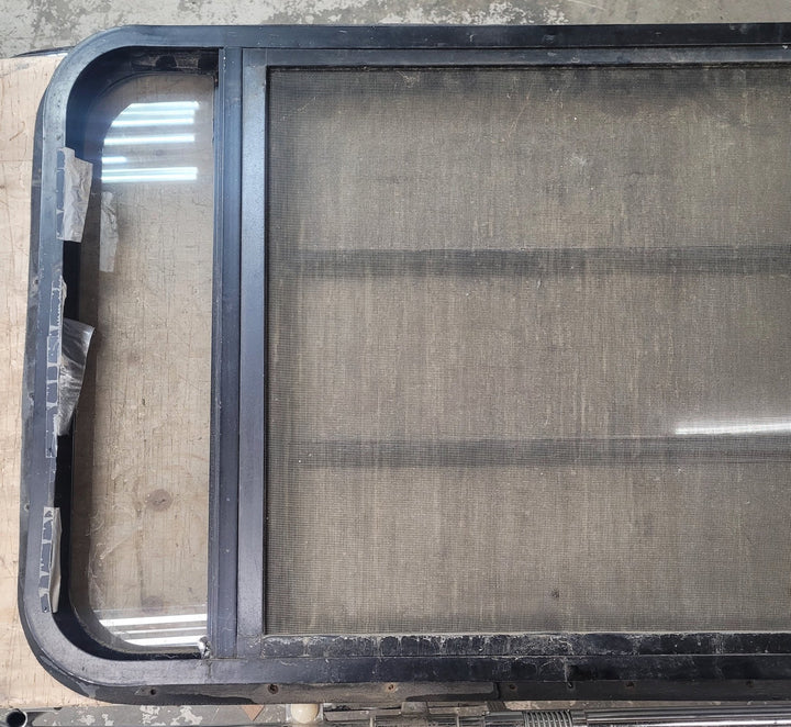 Used Black Radius Opening Window : 35 3/4" W x 22 5/8" H x 1 1/4" D - Young Farts RV Parts