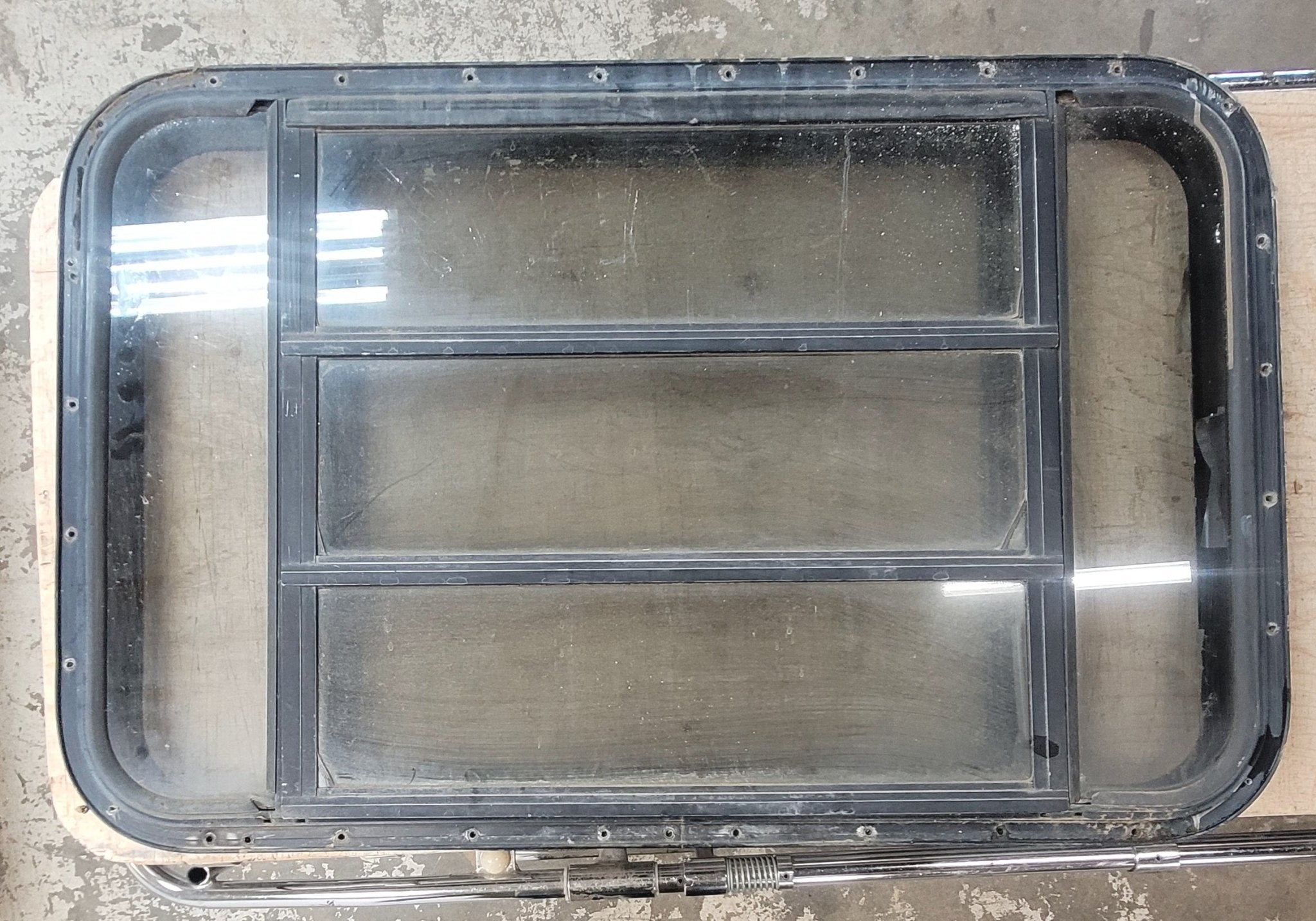 Used Black Radius Opening Window : 35 3/4" W x 22 5/8" H x 1 1/4" D - Young Farts RV Parts