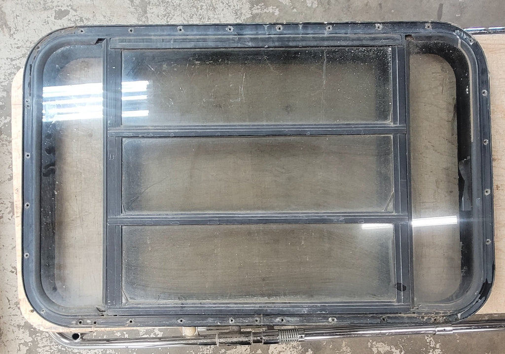 Used Black Radius Opening Window : 35 3/4" W x 22 5/8" H x 1 1/4" D - Young Farts RV Parts