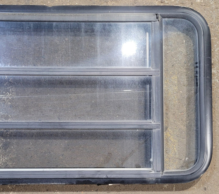 Used Black Radius Opening Window : 41 1/2" W x 21 3/4" H x 1 1/4" D - Young Farts RV Parts