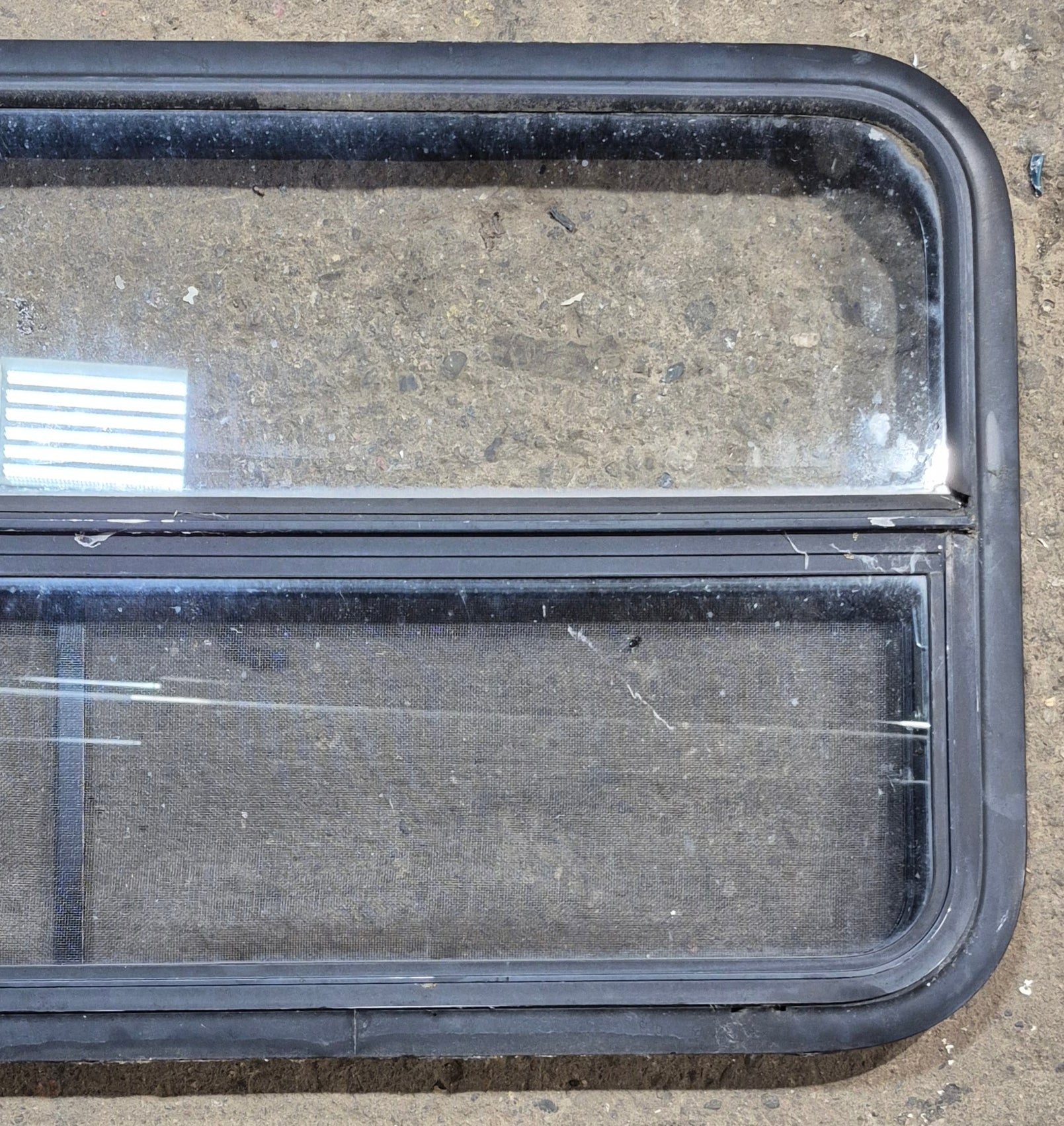 Used Black Radius Opening Window : 41 1/4" W x 21 1/4" H x 1 5/8" - Young Farts RV Parts