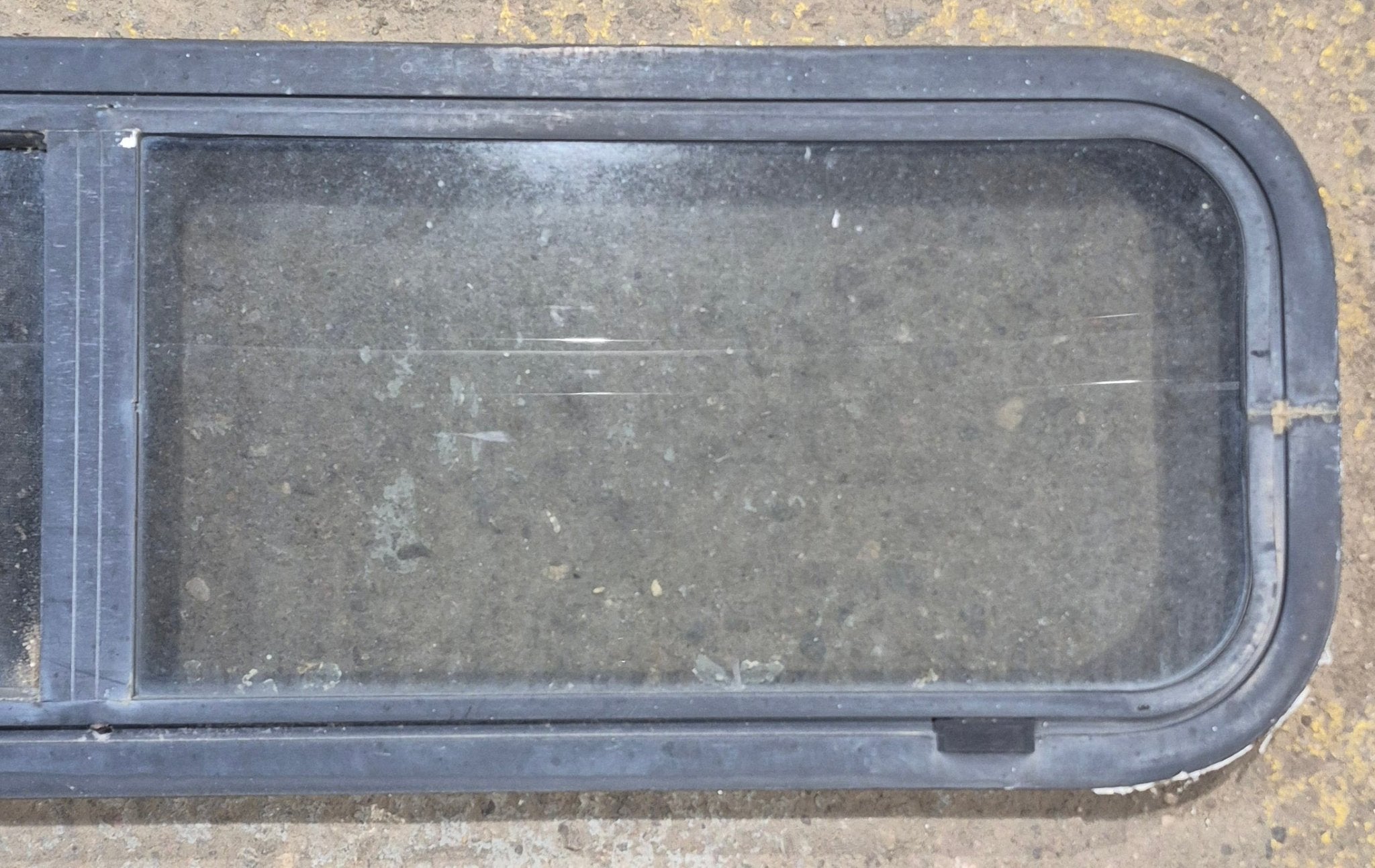 Used Black Radius Opening Window : 42 1/4" W x 11 3/4" H x 1 7/8" - Young Farts RV Parts