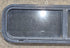 Used Black Radius Opening Window : 42 1/4" W x 11 3/4" H x 1 7/8" - Young Farts RV Parts