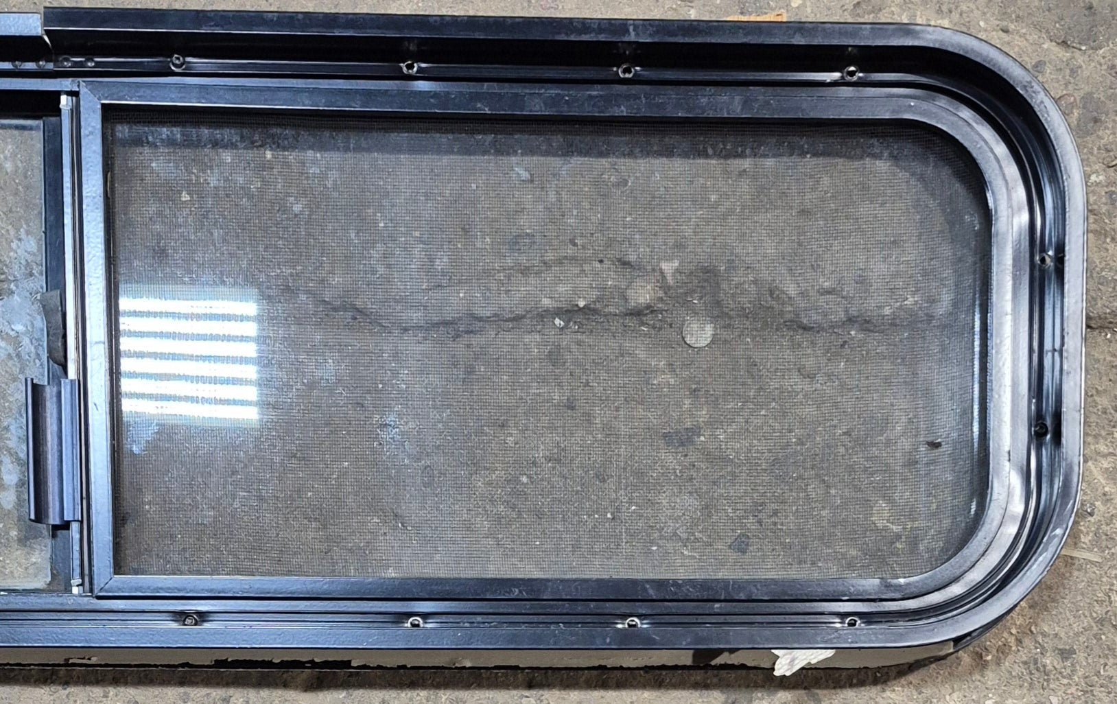 Used Black Radius Opening Window : 42 1/4" W x 11 3/4" H x 1 7/8" - Young Farts RV Parts
