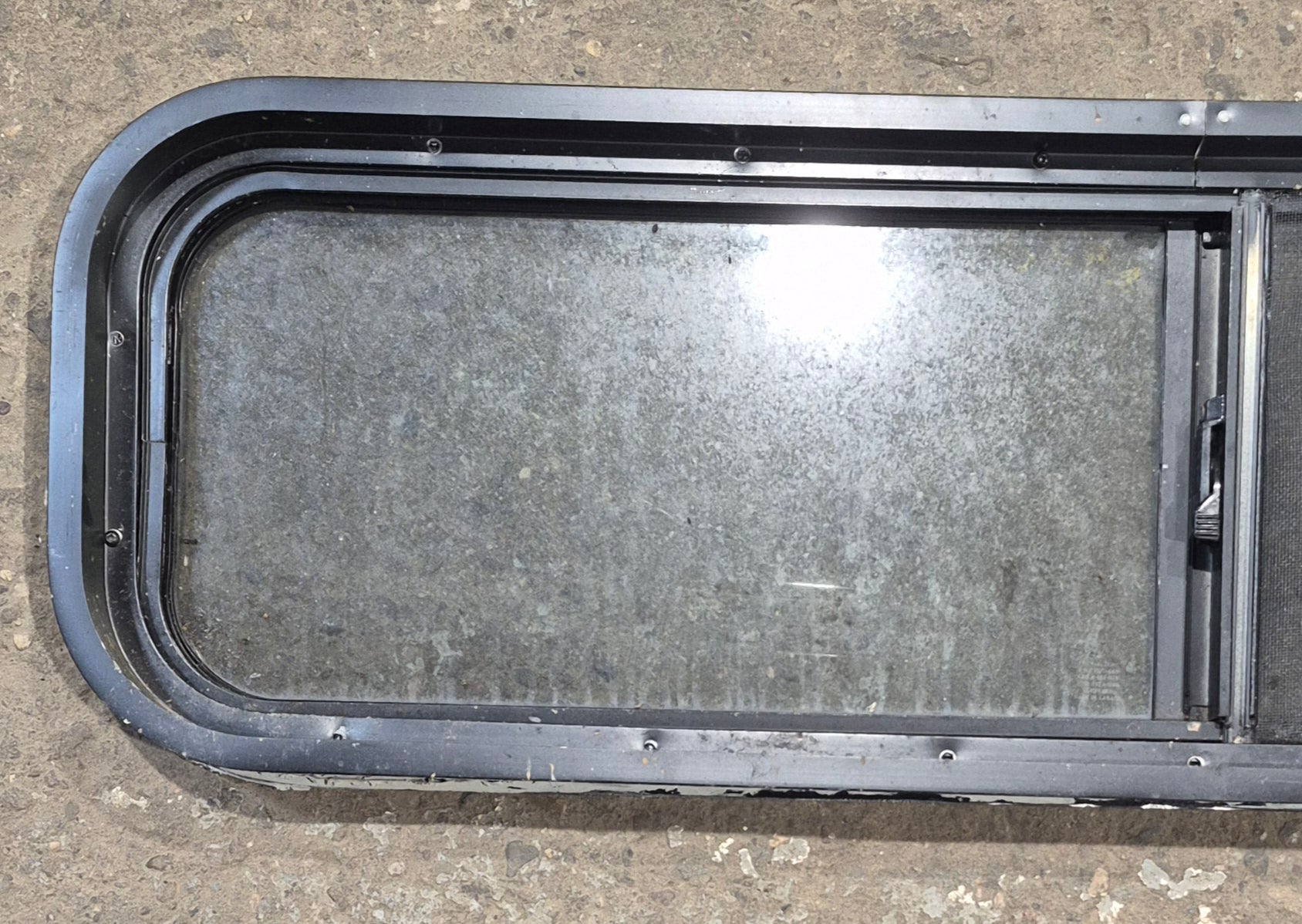 Used Black Radius Opening Window : 42 1/4" W x 11 3/4" H x 1 7/8" - Young Farts RV Parts