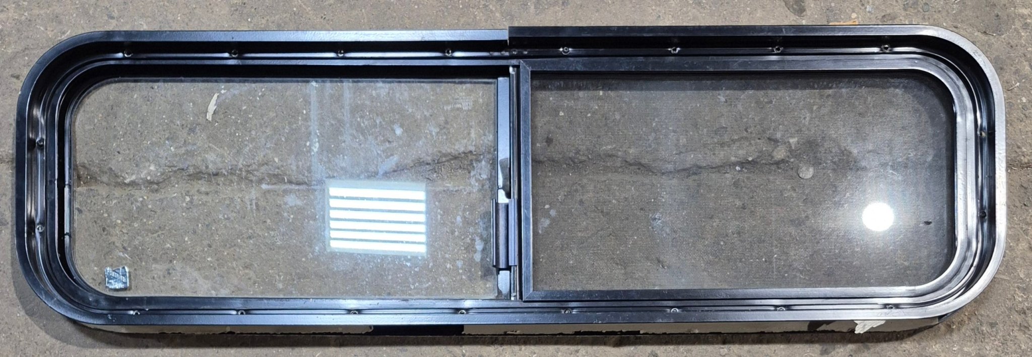 Used Black Radius Opening Window : 42 1/4" W x 11 3/4" H x 1 7/8" - Young Farts RV Parts