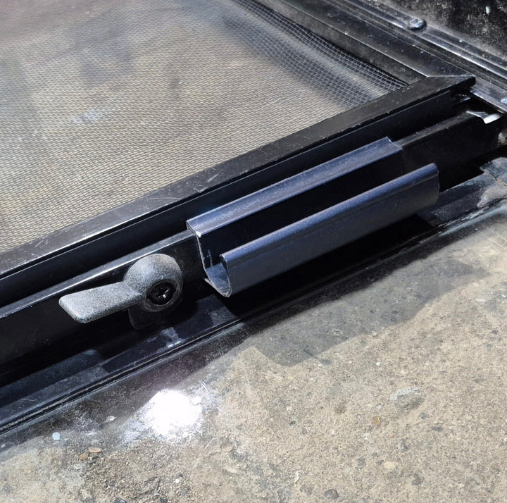 Used Black Radius Opening Window : 42 1/4" W x 11 3/4" H x 1 7/8" - Young Farts RV Parts