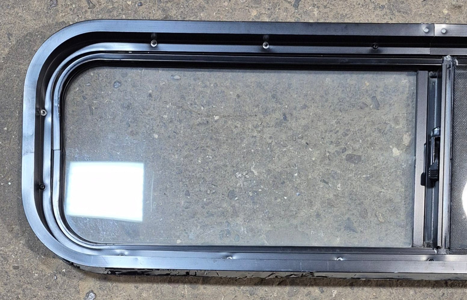 Used Black Radius Opening Window : 42 1/4" W x 11 3/4" H x 2" - Young Farts RV Parts