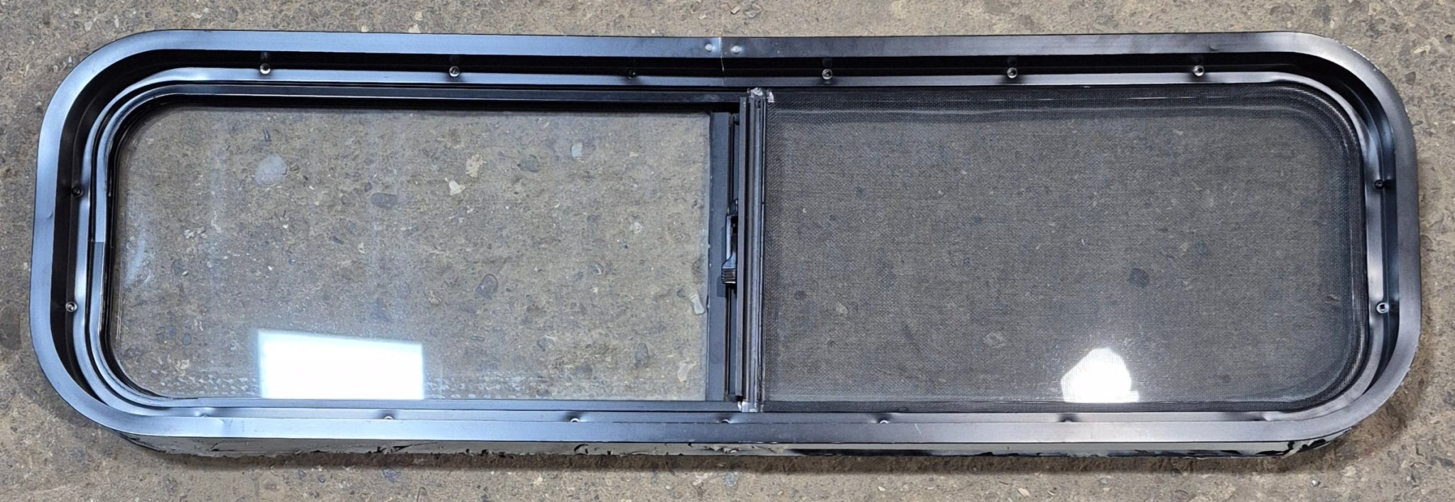 Used Black Radius Opening Window : 42 1/4" W x 11 3/4" H x 2" - Young Farts RV Parts