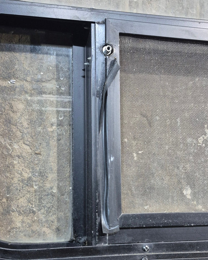 Used Black Radius Opening Window : 45 1/4" W x 21 1/4" H x 1 7/8" D - Young Farts RV Parts