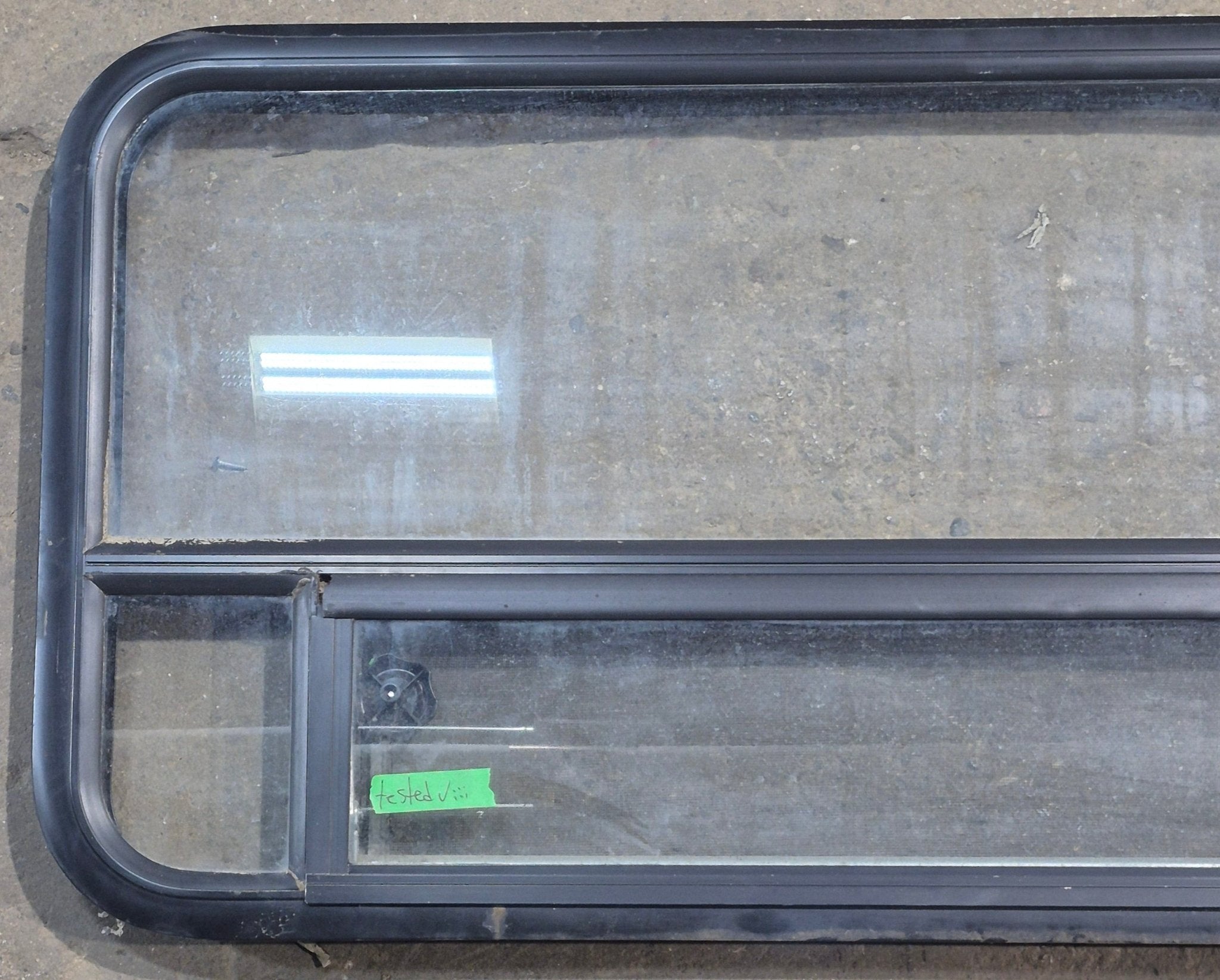 Used Black Radius Opening Window : 45 1/4" W x 21 1/4" H x 1 7/8" D - Young Farts RV Parts