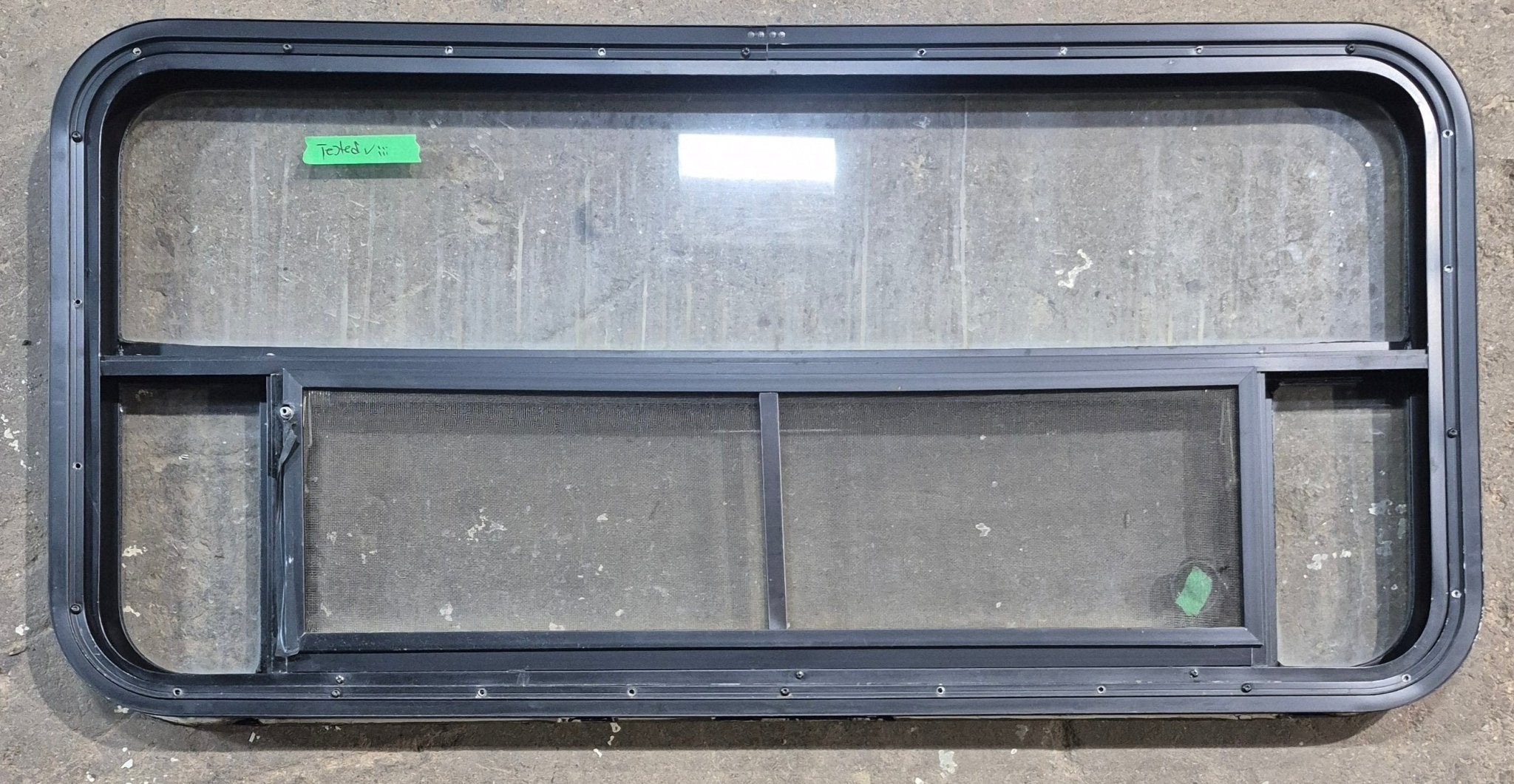 Used Black Radius Opening Window : 45 1/4" W x 21 1/4" H x 1 7/8" D - Young Farts RV Parts