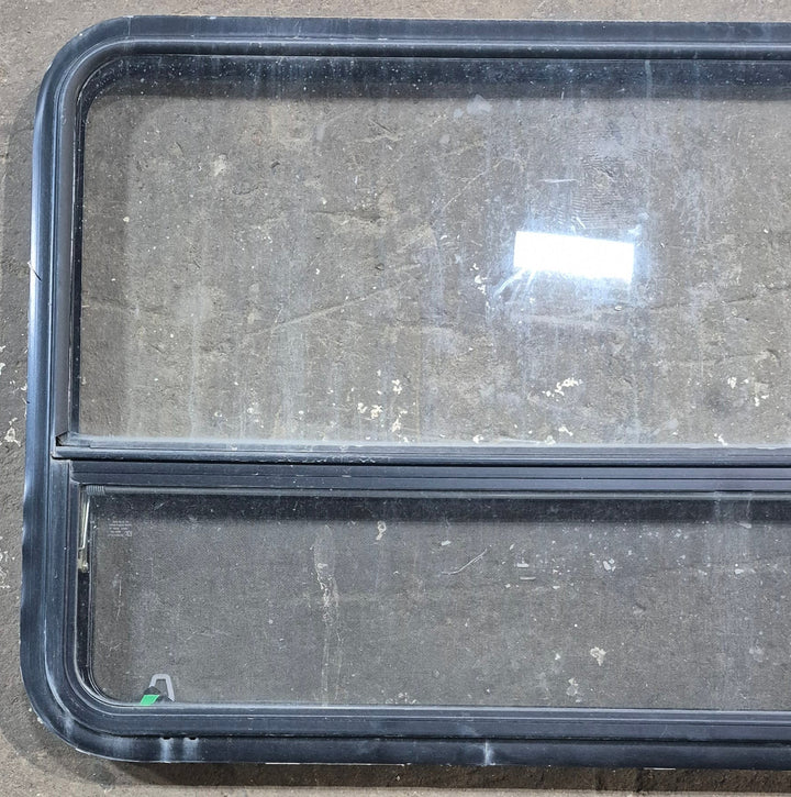Used Black Radius Opening Window : 47 1/2" W x 28 1/4" H x 1 1/4" D - Young Farts RV Parts