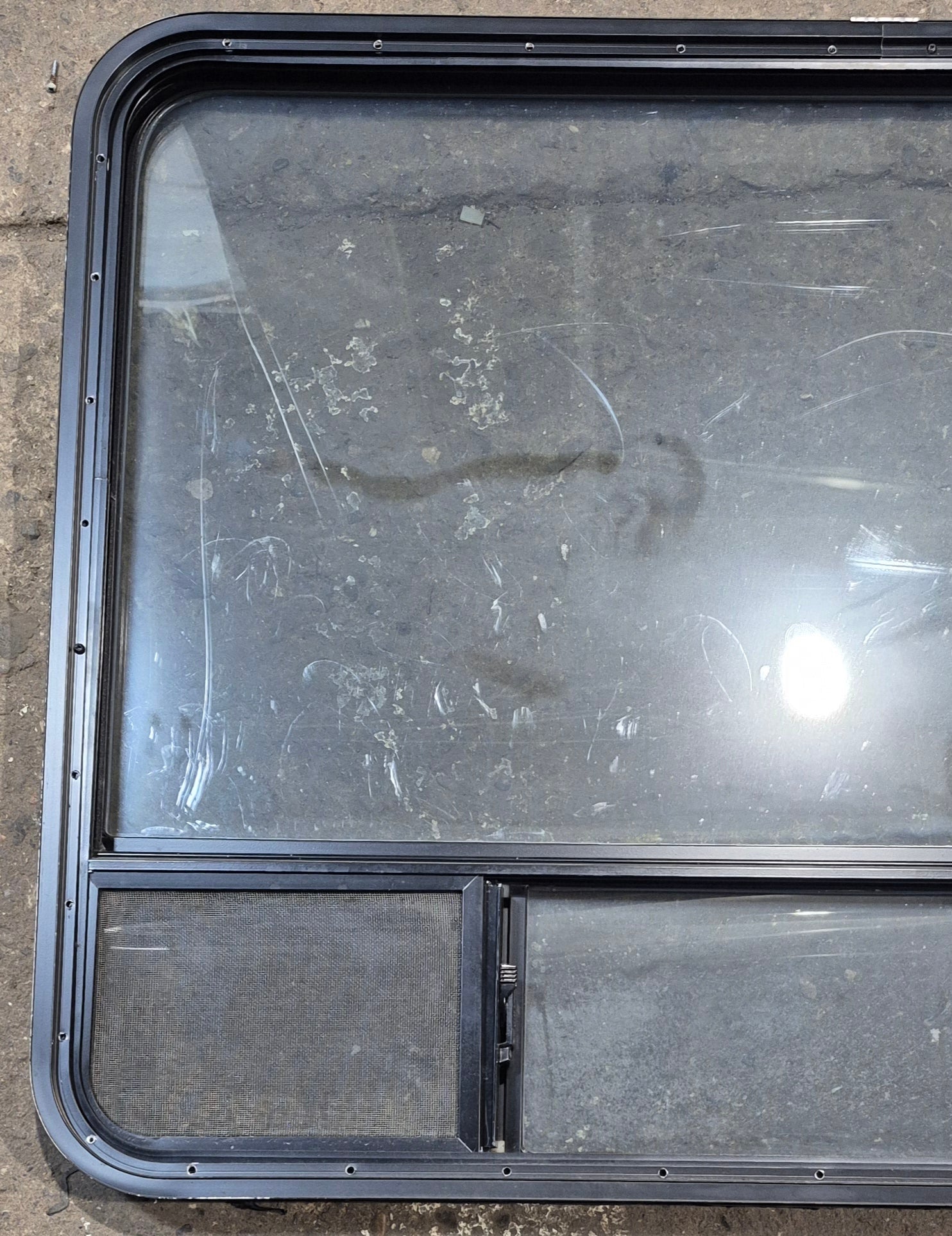 Used Black Radius Opening Window : 47 1/4" W x 34 1/4" H x 1 3/4" D - Young Farts RV Parts