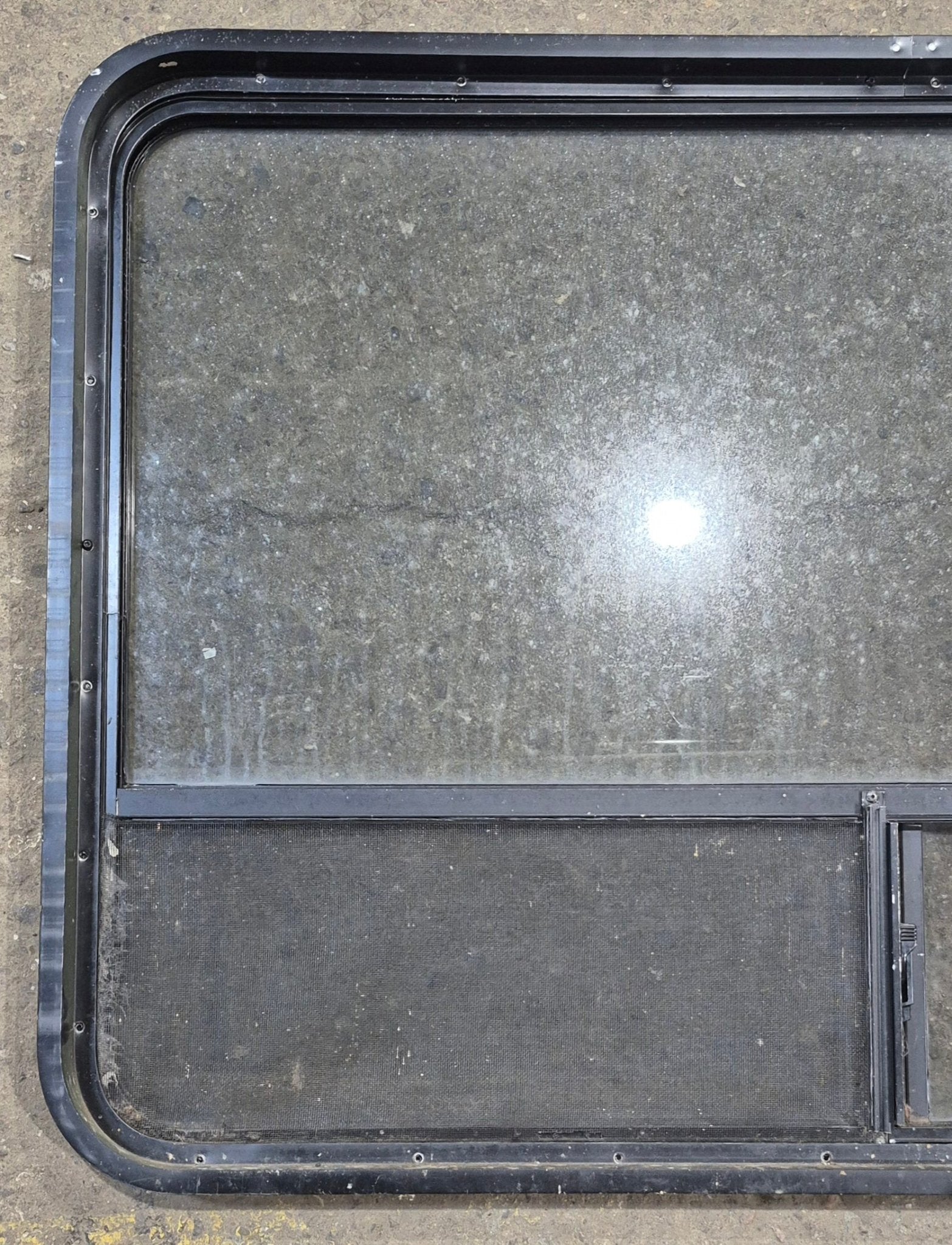 Used Black Radius Opening Window : 48 1/4" W x 31 3/4" H x 1 7/8" - Young Farts RV Parts