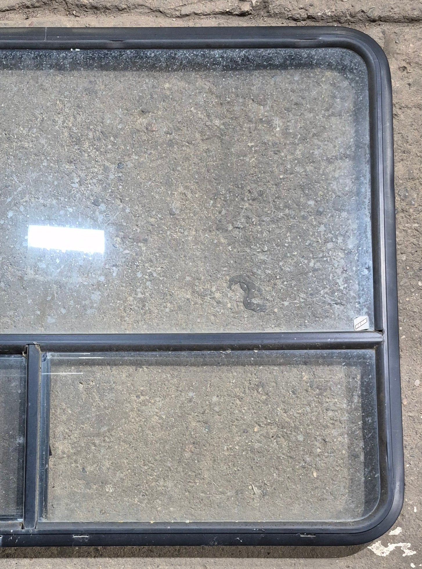 Used Black Radius Opening Window : 48 1/4" W x 35 3/4" H x 1 5/8" D - Young Farts RV Parts