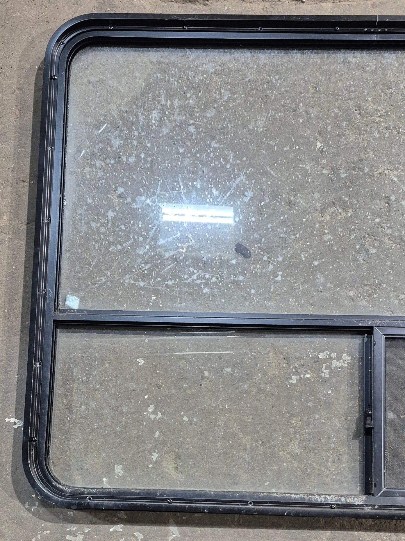 Used Black Radius Opening Window : 48 1/4" W x 35 3/4" H x 1 5/8" D - Young Farts RV Parts
