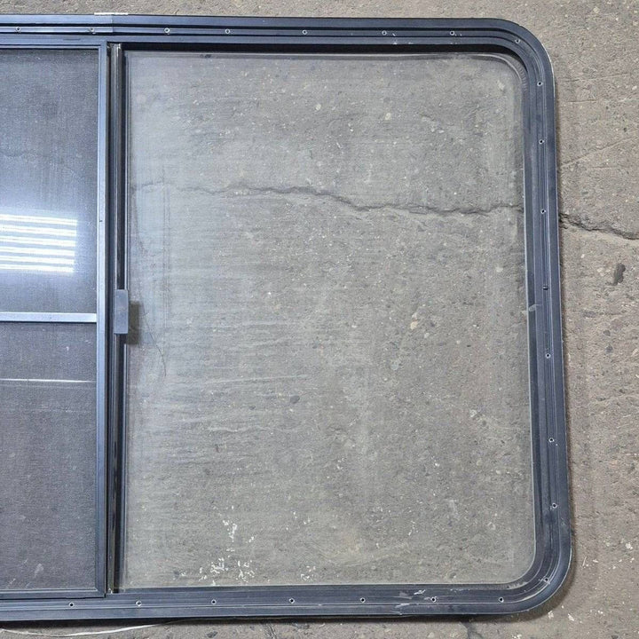 Used Black Radius Opening Window - 53 1/2" X 35 1/2" X 1 1/4" - Young Farts RV Parts