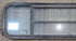 Used Black Radius Opening Window : 59 1/2" W x 14 3/4" H x 1 3/4" - Young Farts RV Parts